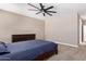 Large bedroom with ceiling fan and carpet at 3317 N 300Th Dr, Buckeye, AZ 85396