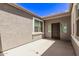 Small, private courtyard with a dark brown door and windows at 3317 N 300Th Dr, Buckeye, AZ 85396