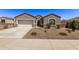 Single-story home with a two-car garage and desert landscaping at 3317 N 300Th Dr, Buckeye, AZ 85396