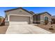 Gray stucco house with a two-car garage and small front yard at 3317 N 300Th Dr, Buckeye, AZ 85396