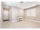 Bright living room with tile floors and neutral walls at 3317 N 300Th Dr, Buckeye, AZ 85396