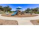 Community playground with play structures and shaded areas at 3317 N 300Th Dr, Buckeye, AZ 85396