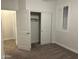 Well-lit bedroom with closet and carpet flooring at 3480 E Sheffield Rd, Gilbert, AZ 85296