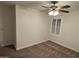 Bedroom with ceiling fan and window shutters at 3480 E Sheffield Rd, Gilbert, AZ 85296