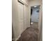 Hallway with carpet and access to laundry room at 3480 E Sheffield Rd, Gilbert, AZ 85296