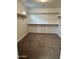 Spacious walk-in closet with ample shelving and carpeting at 3480 E Sheffield Rd, Gilbert, AZ 85296