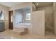 Spa-like bathroom featuring a luxurious soaking tub and a walk-in shower at 36050 N Summit Dr, Cave Creek, AZ 85331