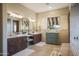 Elegant bathroom with double sinks, a large soaking tub, and a separate shower at 36050 N Summit Dr, Cave Creek, AZ 85331