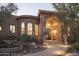 Home exterior features stone facade, arched entryway, and fountain at 36050 N Summit Dr, Cave Creek, AZ 85331