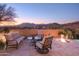 Relaxing patio furniture with fire pit at 36050 N Summit Dr, Cave Creek, AZ 85331