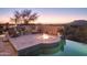 Outdoor patio with fire pit and pool view at 36050 N Summit Dr, Cave Creek, AZ 85331