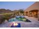 Luxury pool and spa with fire pit and mountain views at 36050 N Summit Dr, Cave Creek, AZ 85331