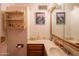 Bathroom with a vanity, large mirror, and corner sink at 3616 S 67Th Ave, Phoenix, AZ 85043