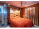 Main bedroom with built-in shelving and a ceiling fan at 3616 S 67Th Ave, Phoenix, AZ 85043