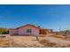 Side view of pink stucco home with large yard at 3616 S 67Th Ave, Phoenix, AZ 85043