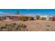 Ranch style home with a large front yard and cactus at 3616 S 67Th Ave, Phoenix, AZ 85043