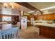 Bright kitchen boasts ample cabinetry and an island with seating at 3616 S 67Th Ave, Phoenix, AZ 85043