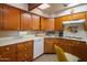 Kitchen with white countertops and wood cabinets at 3616 S 67Th Ave, Phoenix, AZ 85043