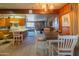 Kitchen with view into living area, wood cabinets, and a breakfast bar at 3616 S 67Th Ave, Phoenix, AZ 85043