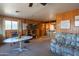 Living room with wood paneling, and a view to dining area at 3616 S 67Th Ave, Phoenix, AZ 85043