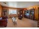 Living room with leather furniture and wood-paneled walls at 3616 S 67Th Ave, Phoenix, AZ 85043