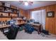 Home office with built-in shelving and wood paneling at 3616 S 67Th Ave, Phoenix, AZ 85043