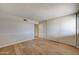 Bright bedroom with light wood floors and large closet at 3810 N Maryvale Pkwy # 1060, Phoenix, AZ 85031