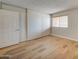 Spacious bedroom featuring wood floors and ample closet space at 3810 N Maryvale Pkwy # 1060, Phoenix, AZ 85031