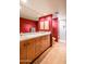 Double sink bathroom with red walls and walk-in shower at 39565 N 107Th Way, Scottsdale, AZ 85262