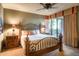 Guest bedroom with wooden bed frame and access to private patio at 39565 N 107Th Way, Scottsdale, AZ 85262