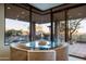 Bright kitchen nook with glass table and chairs, offering an outdoor patio view at 39565 N 107Th Way, Scottsdale, AZ 85262