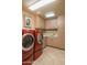 Laundry room with front load washer and dryer at 39565 N 107Th Way, Scottsdale, AZ 85262