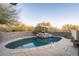 Inviting curved pool with stone fountain feature at 39565 N 107Th Way, Scottsdale, AZ 85262