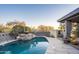 Relaxing pool area with fire pit and landscaping at 39565 N 107Th Way, Scottsdale, AZ 85262