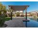 Relaxing backyard oasis featuring a refreshing pool, pergola, and spacious patio at 4058 E Mesquite St, Gilbert, AZ 85296