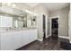 Elegant bathroom with double vanity, granite countertop, and large mirror at 4058 E Mesquite St, Gilbert, AZ 85296