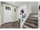 Bright entryway with tile flooring, staircase, and storage at 4058 E Mesquite St, Gilbert, AZ 85296