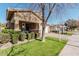 Two-story house with a landscaped yard and a swing on the porch at 4058 E Mesquite St, Gilbert, AZ 85296