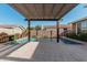 Enjoy this inviting pool area complete with a pergola for shade at 4058 E Mesquite St, Gilbert, AZ 85296