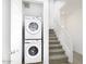 Stackable washer and dryer in a closet near the stairs at 4130 E Pinto Dr, Gilbert, AZ 85296