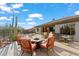 Inviting backyard with pool, patio furniture, and fire pit at 41711 N Maidstone Ct, Anthem, AZ 85086