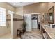 Spa-like bathroom with walk-in shower, large closet, and dual sinks at 41711 N Maidstone Ct, Anthem, AZ 85086