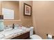 Small bathroom with granite vanity and updated fixtures at 41711 N Maidstone Ct, Anthem, AZ 85086