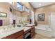 Bathroom with soaking tub, shower, and double vanity at 41711 N Maidstone Ct, Anthem, AZ 85086