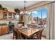 Kitchen dining area with wood table and chairs, offering a view of the backyard at 41711 N Maidstone Ct, Anthem, AZ 85086