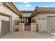 Front entry with a gated courtyard and stone accents at 41711 N Maidstone Ct, Anthem, AZ 85086