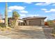 Single-story home with a two-car garage and desert landscaping at 41711 N Maidstone Ct, Anthem, AZ 85086