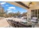 Relaxing patio with seating area and stunning views of the pool and backyard at 41711 N Maidstone Ct, Anthem, AZ 85086