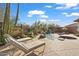 Relaxing pool and spa area with lounge chairs at 41711 N Maidstone Ct, Anthem, AZ 85086