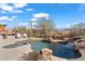 Inviting pool and spa with waterfall feature, surrounded by a desert landscape at 41711 N Maidstone Ct, Anthem, AZ 85086